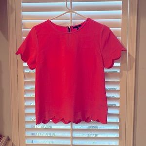 Woman’s scalloped top